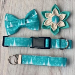 A dog collar and leash set with bows, flowers, and trees.